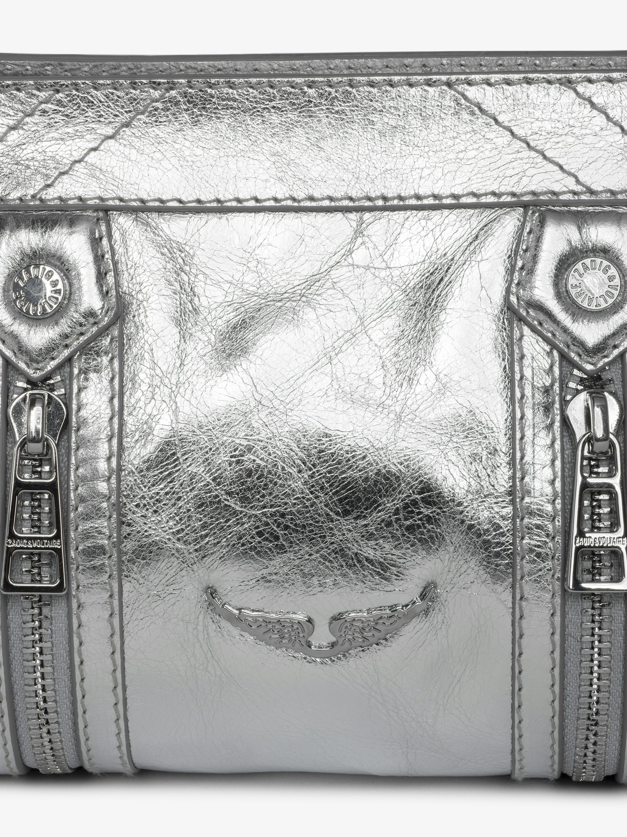 Sunny Mood Vintage Metal Bag - Small metallic leather bag with adjustable shoulder strap and wing signature.